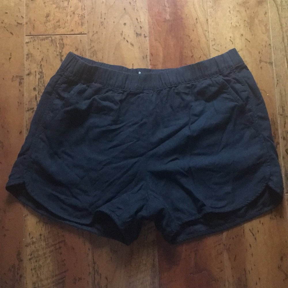 black linen shorts.
